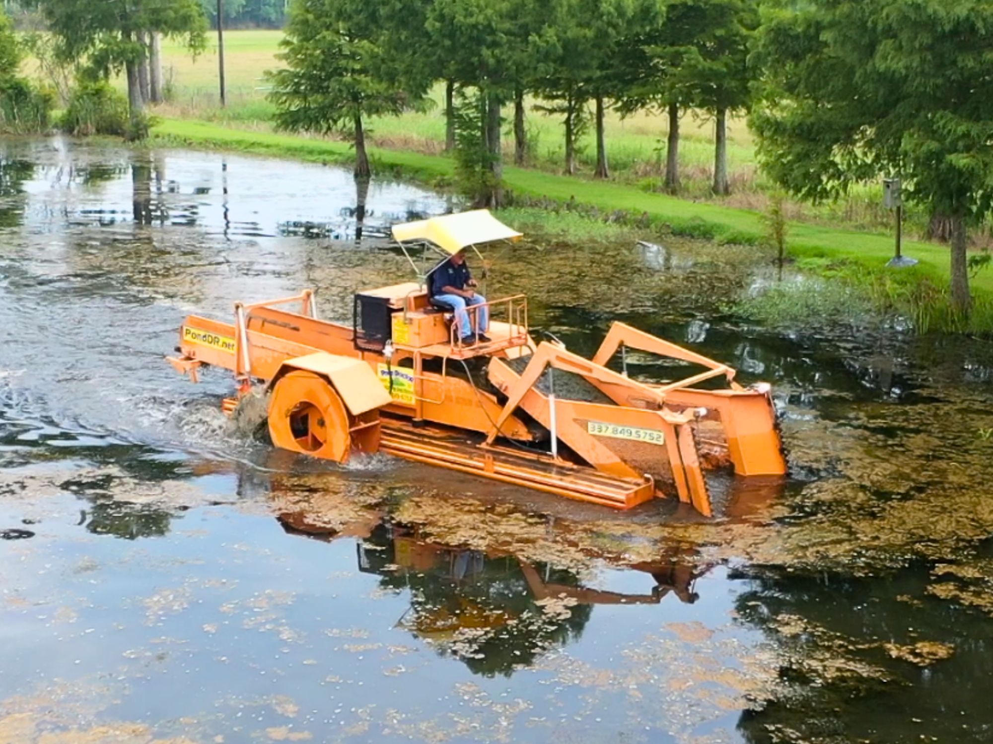 Aquamarine H7-400 dredging system removing sediment from pond
