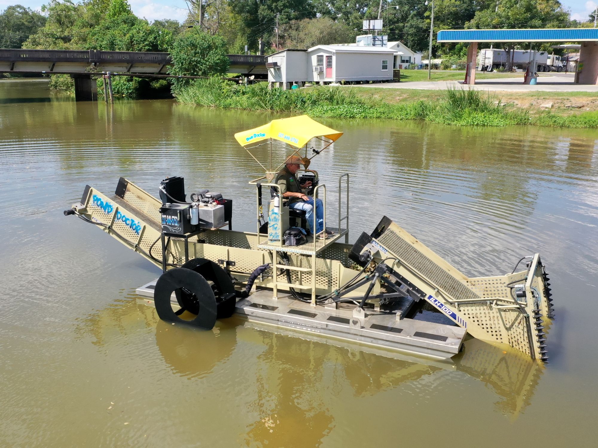 Pond Doctor's ILH100 aquatic weed harvester in operation