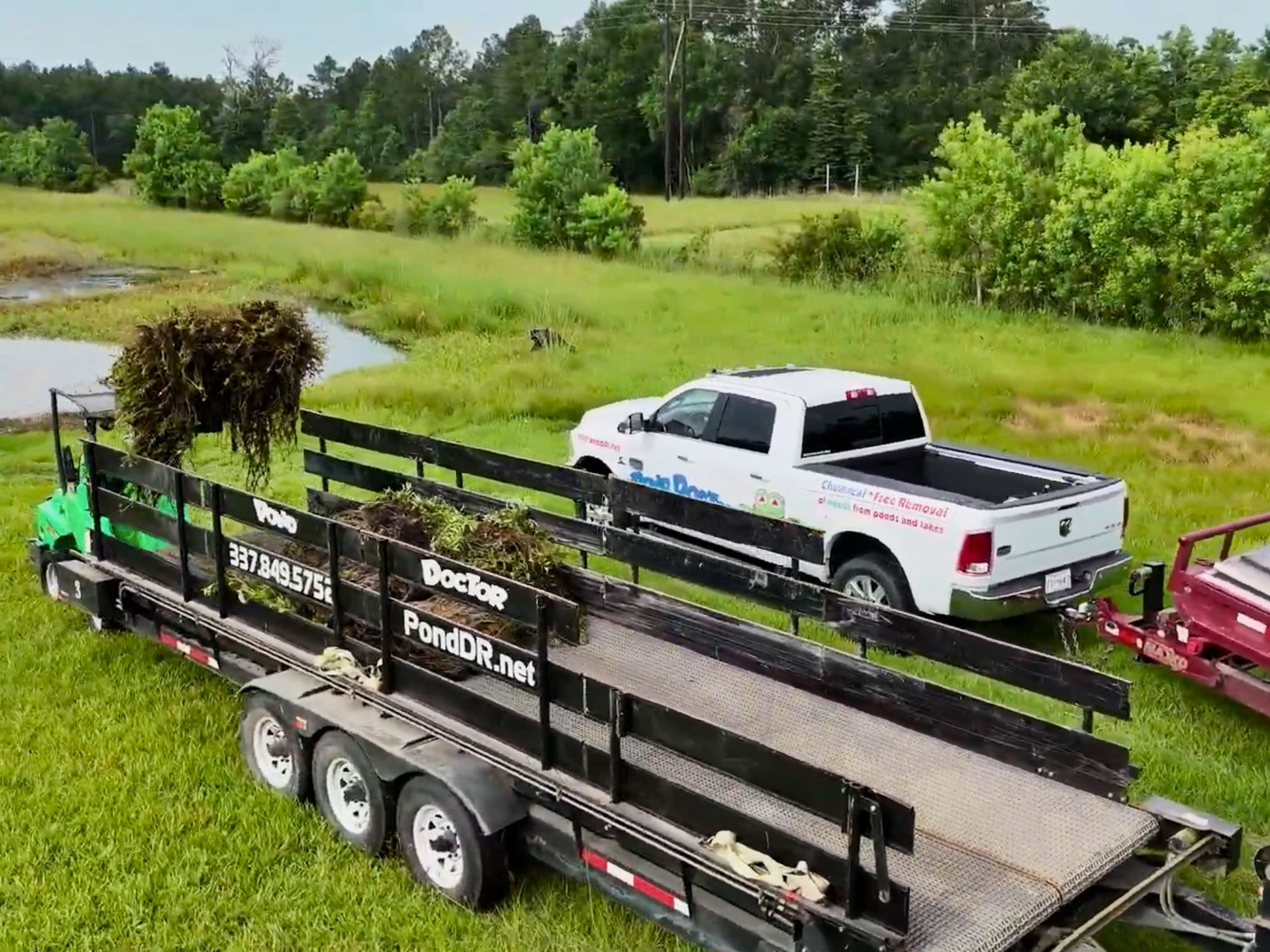 Pond Doctor truck and trailer for hauling debris